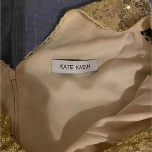 Size 12 and height 5ft tall long braidmaid dress color is gold